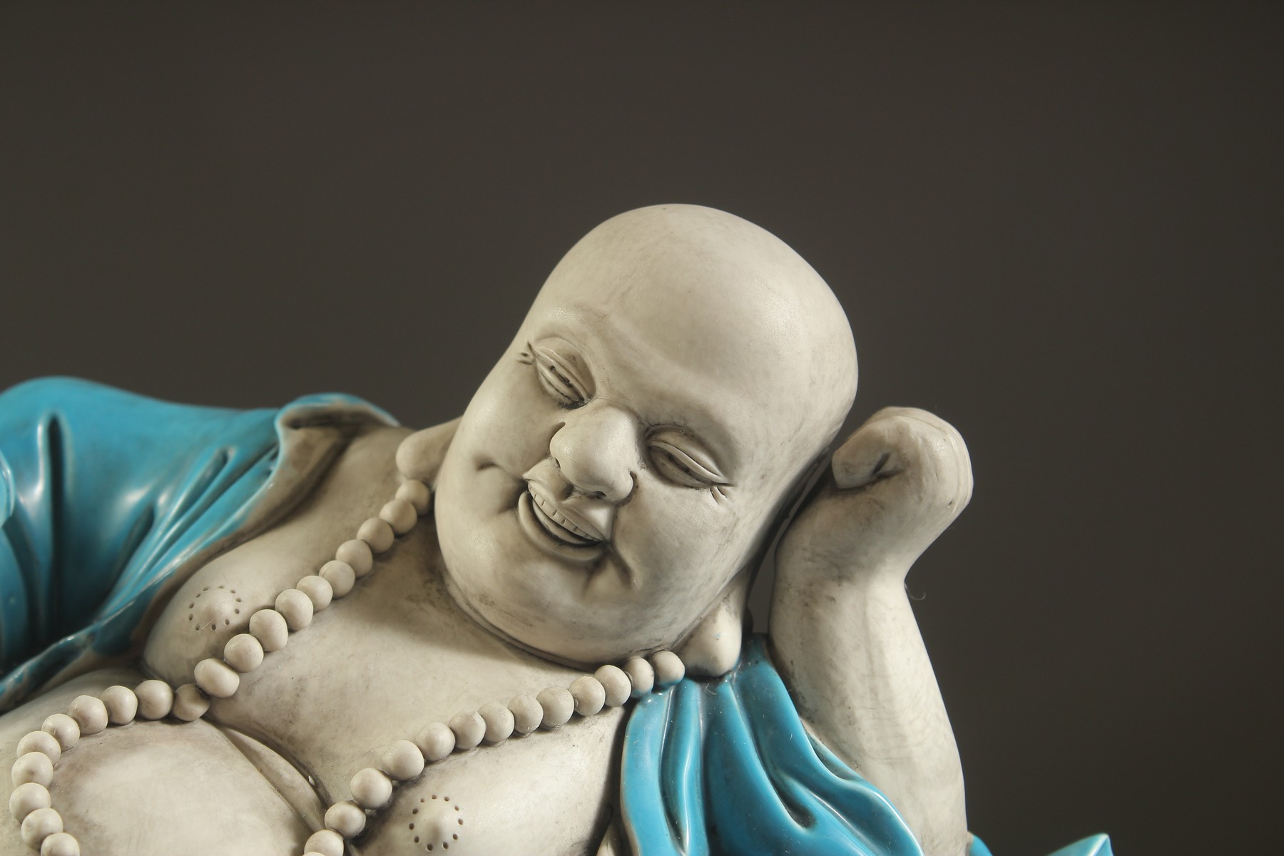 A LARGE TURQUOISE GLAZED POTTERY HAPPY BUDDHA, in reclining position with coiled dragon at his feet, - Image 2 of 7