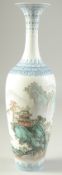 A CHINESE REPUBLIC EGGSHELL PORCELAIN VASE, and wooden stand, the vase painted with a mountainous