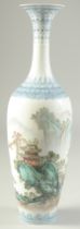 A CHINESE REPUBLIC EGGSHELL PORCELAIN VASE, and wooden stand, the vase painted with a mountainous