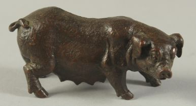 A BRONZE OKIMONO OF A SOW, 7.5cm long.