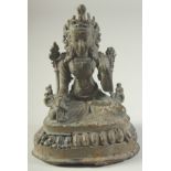 A SMALL BRONZE FIGURE OF A SEATED DEITY, 13cm high.