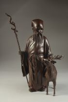 A FINE EARLY 20TH CENTURY JAPANESE BRONZE OKIMONO OF SHOU LAO AND DEER BY HOZAN, signed, gifted as