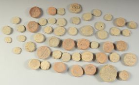 A COLLECTION OF FIFTY ISLAMIC AND INDIAN CLAY SEALS OR TOKENS, (50).