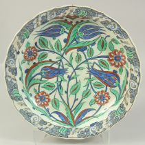 A LARGE 19TH CENTURY FRENCH IZNIK STYLE PORCELAIN DISH, painted with flora in red, blue, and