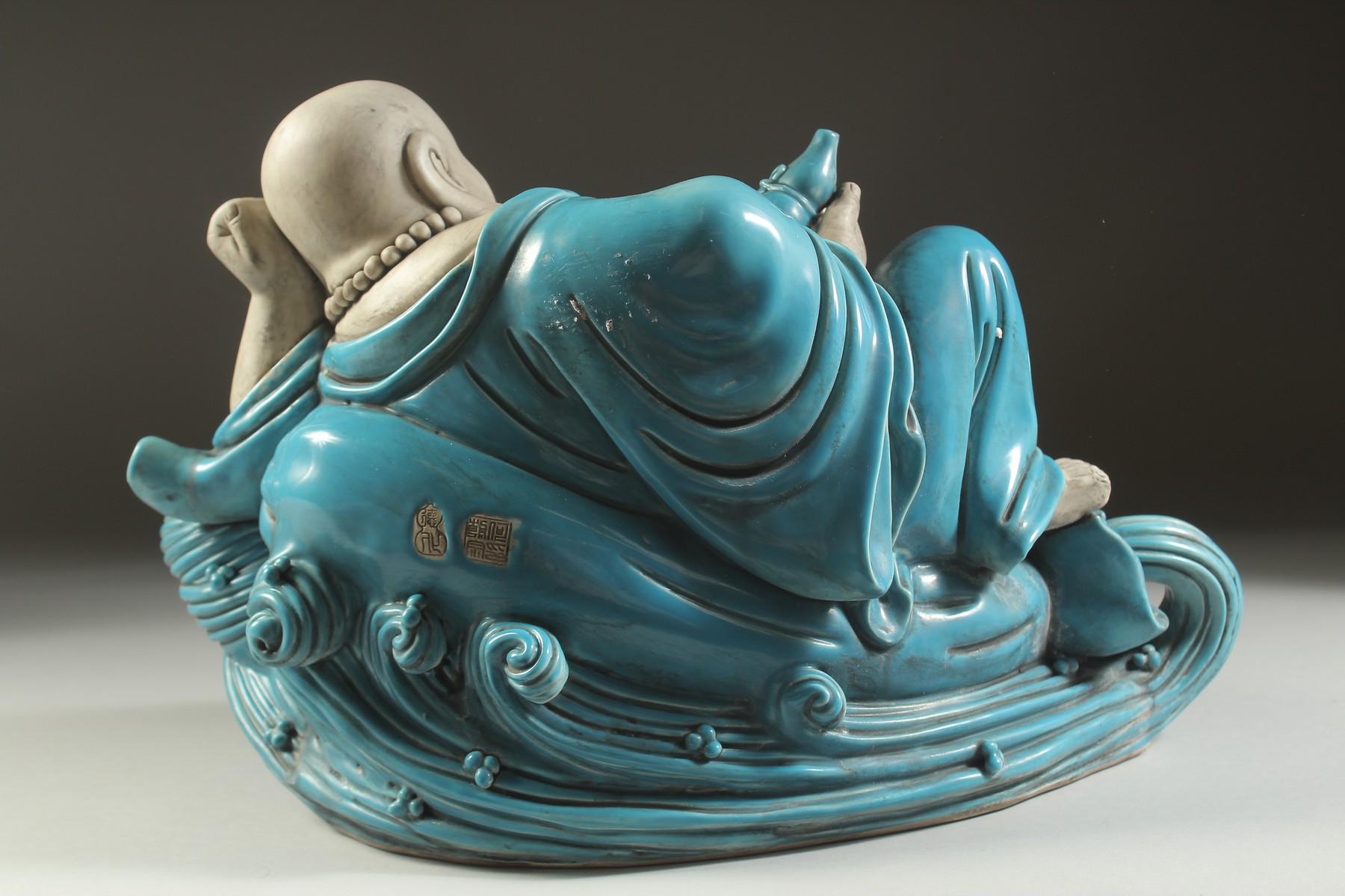 A LARGE TURQUOISE GLAZED POTTERY HAPPY BUDDHA, in reclining position with coiled dragon at his feet, - Image 5 of 7
