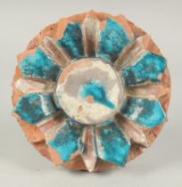 A FINE 17TH-18TH CENTURY MUGHAL INDIAN FLOWER SHAPED TILE, 16cm diameter.