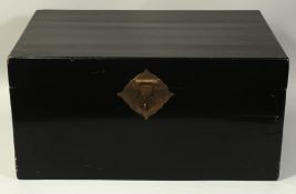 A LARGE BLACK LACQUER CASKET, with hinged lid and brass handles.