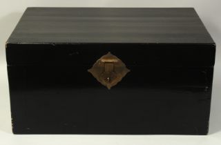 A LARGE BLACK LACQUER CASKET, with hinged lid and brass handles.