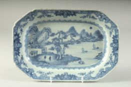 A CHINESE BLUE AND WHITE PORCELAIN RECTANGULAR SERVING DISH, painted with a landscape scene, 27.