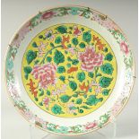 A CHINESE FAMILLE ROSE PORCELAIN FLORAL CHARGER, (af), 36cm diameter.