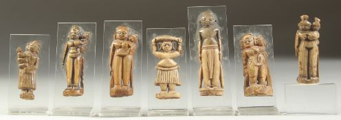 A COLLECTION OF SEVEN 18TH-19TH CENTURY SOUTH INDIAN CARVED BONE FIGURES, on Perspex bases,
