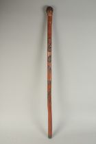 A CHINESE BAMBOO WALKING STICK, carved with snake, 89cm long.