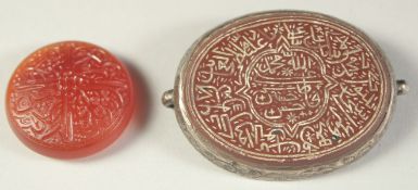 A FINE 19TH CENTURY INDIAN ENGRAVED AGATE AMULET, with silver backing, along with another engraved