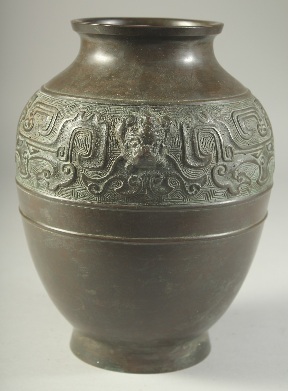 A CHINESE BRONZE VASE, with a band of archaic design and twin beast-head handles, 22cm high. - Image 4 of 6