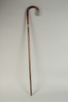 A CHINESE BAMBOO WALKING STICK, with embossed silver mounts, inscribed 'H.E.B', 86cm long.