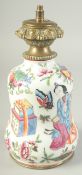 A CHINESE FAMILLE ROSE PORCELAIN LAMP, painted with figures, precious objects, butterflies,