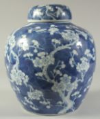 A LARGE CHINESE BLUE AND WHITE PORCELAIN PRUNUS JAR AND COVER, the base with character mark, 29cm