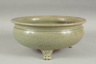 A LARGE CHINESE CELADON GLAZE CIRCULAR CENSER, raised on three moulded legs, 31.5cm diameter, (