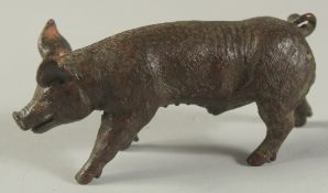 A BRONZE OKIMONO OF A PIG, 8cm long.