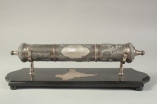 A LATE 19TH -EARLY 20TH CENTURY INDIAN SILVER SCROLL HOLDER, of cylindrical form with vacant