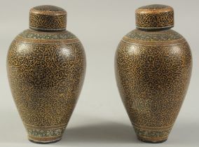 A PAIR OF 19TH CENTURY KASHMIRI LACQUERED LIDDED JARS, 16cm high.