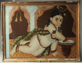 A LARGE LATE 19TH CENTURY SOUTH INDIAN TANJORE REVERSE PAINTING ON GLASS, depicting reclining