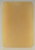 A CHINESE YELLOW JADE RECTANGULAR PENDANT, 5cm x 3.5cm.