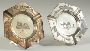 A PAIR OF IRAQI NIELLO AND SILVER SIGNED ASHTRAYS, weight 139g, 12cm wide.