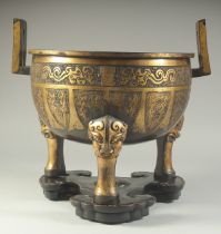 A LARGE AND HEAVY CHINESE GILT BRONZE TRIPOD CENSER, on fitted hardwood stand, censer with twin