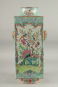 A CHINESE TURQUOISE GROUND FAMILLE ROSE PORCELAIN VASE, beautifully painted with panels of exotic