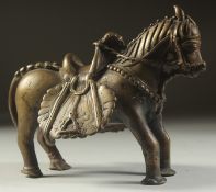 A 17TH-18TH CENTURY SOUTH INDIAN DECCANI BRONZE SADDLED HORSE, the saddle with lions head finial,