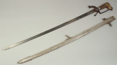 A VERY FINE 19TH CENTURY MOROCCAN RHINO HORN HILTED NIMCHA SWORD, with engraved silver scabbard,