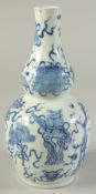 A CHINESE BLUE AND WHITE PORCELAIN DOUBLE GOURD VASE, painted with lucky auspicious symbols, (rim