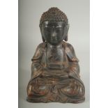 A CHINESE BRONZE SEATED BUDDHA, with traces of gilt, 22cm high.