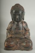 A CHINESE BRONZE SEATED BUDDHA, with traces of gilt, 22cm high.