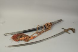AN INDIAN SWORD WITH SILVER INLAID SCABBARD, 100cm long.