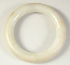 A FINE EARLY CHINESE JADE BANGLE.