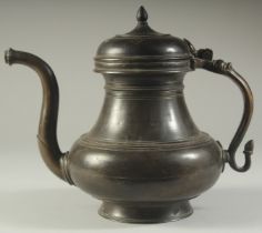 A FINE 18TH CENTURY MUGHAL INDIAN BRONZE EWER, 24cm high.