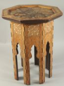 A 19TH CENTURY SYRIAN MOTHER OF PEARL AND INLAID WOODEN OCTAGONAL TABLE, the table top with