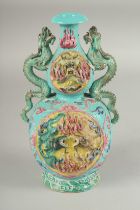 A CHINESE TURQUOISE GROUND TWIN HANDLE DOUBLE GOURD VASE, with moulded and carved relief