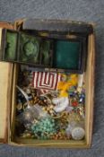 Costume jewellery and an old leather jewellery box.