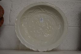 A large Chinese molded blanc de chine dish.