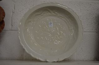 A large Chinese molded blanc de chine dish.