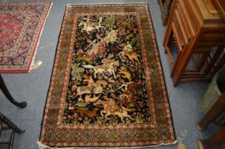 A good Persian rug, rich blue ground decorated with a hunting scene, 155cm x 94cm.