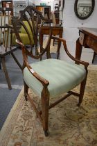 A George III satinwood and painted shield back elbow chair with upholstered seat (faults and old