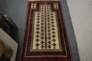 A Persian prayer rug, 173cm x 99cm.