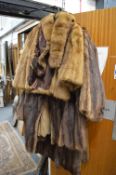 A collection of four ladies fur jackets and coats.