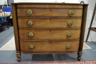 A good 19th century mahogany chest of four slightly curving graduated long drawers with reeded