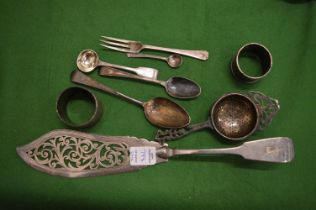 A group of small silver items and a plated fish slice.