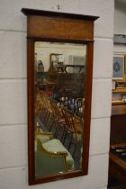 An inlaid mahogany pier mirror.